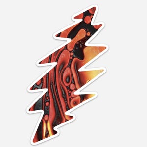 May include: A red, orange, and black lightning bolt design with a swirling, abstract pattern. The design is reminiscent of a popular band's logo.