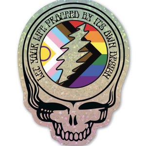 May include: A sticker with a rainbow and transgender pride flag design inside a Grateful Dead Steal Your Face skull. The text around the flag reads "Let Your Life Proceed By Its Own Design".