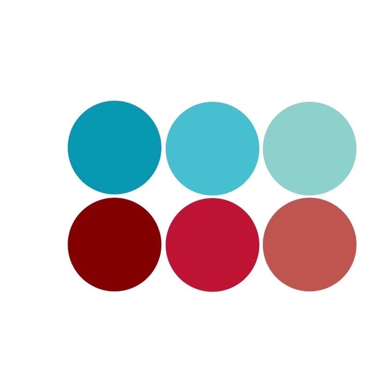 May include: Six colorful circles arranged in two rows of three. The top row is turquoise, light blue, and light green. The bottom row is dark red, bright red, and coral.