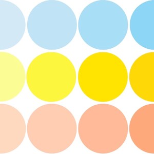 May include: A gradient of nine circles, starting with light blue, transitioning to yellow, and ending with peach.