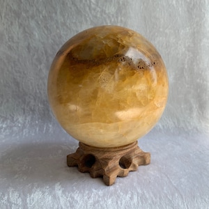 Large Golden Healer Quartz Sphere with Carved Wood Stand