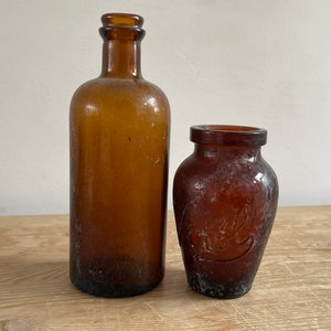 Vintage set of two brown glass bottles