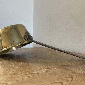 Vintage brass pan with cast iron handle