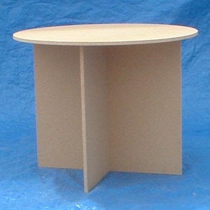May include: A round, light brown wooden table with a simple, sturdy design. The table has a circular top and four legs that meet in the center.