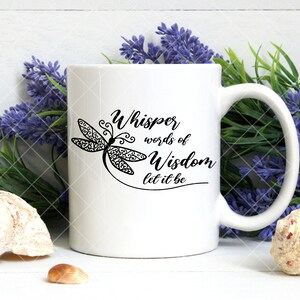 May include: White ceramic mug with a black dragonfly design and the text "Whisper words of Wisdom let it be".