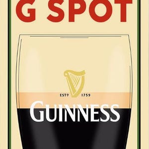 May include: Poster with a cream background and a green border. The text "THE REAL G SPOT" is in red. Below is a pint of Guinness with the brand name in white and the harp logo. The text "ESTD 1759" is also visible.
