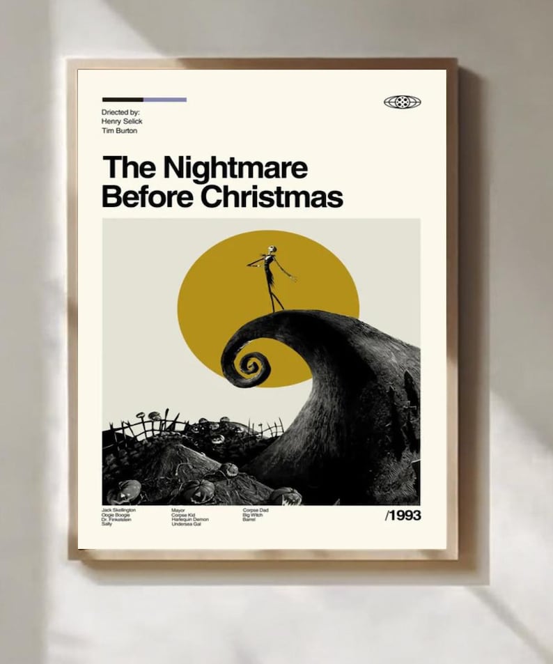 May include: A framed poster for "The Nightmare Before Christmas" movie. The poster features a black and white illustration of a character on a hill with a yellow sun in the background. The movie title is in bold black letters.