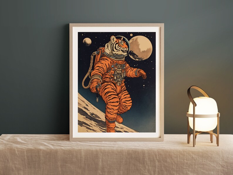 May include: A framed illustration of a tiger wearing a space suit and helmet, walking on the moon. The background is a dark blue space with stars and planets.