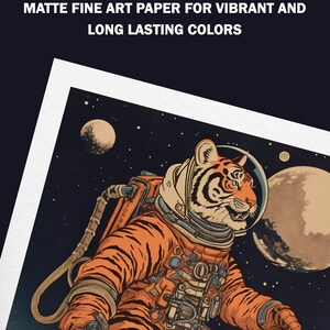 May include: A digital illustration of a tiger wearing an astronaut suit and walking on the moon. The tiger is orange and black with white stripes. The background is a dark blue with stars and a white moon.