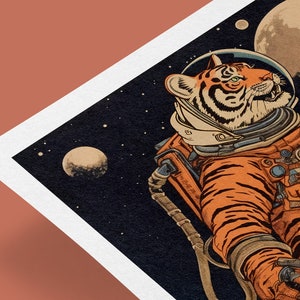 May include: A tiger wearing an orange astronaut suit floats in space. The tiger is looking to the right, with a planet in the background. The tiger has black stripes and a white muzzle.