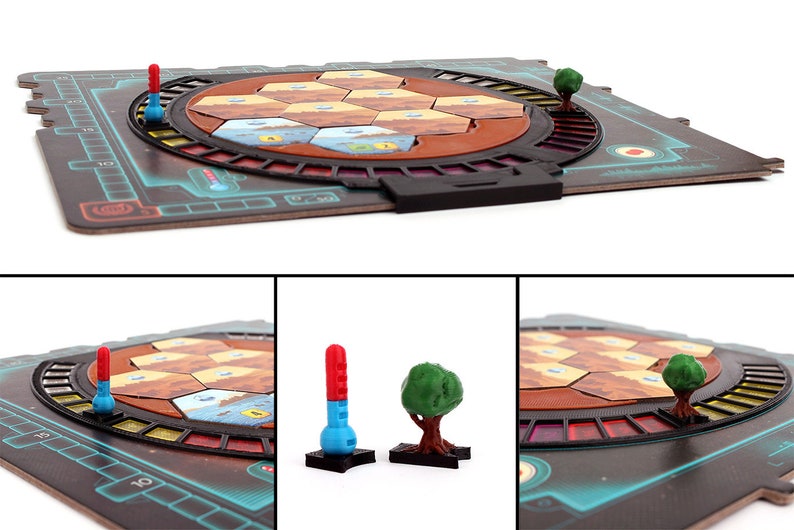 May include: A board game with a circular playing area featuring hexagonal tiles in shades of brown, orange, and blue. The game includes red and blue game pieces, and green tree pieces. The board is made of cardboard and has a black plastic frame.