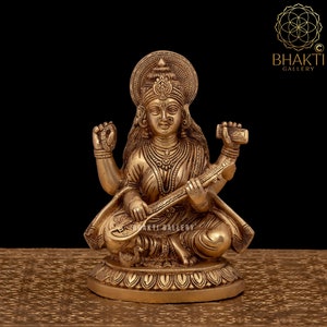 Brass Saraswati Statue, 21 cm big Golden Finish Brass Goddess Saraswati Idol, Hindu Mother goddess of Arts, Music, Knowledge & Wisdom