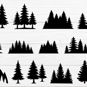 May include: A collection of black silhouette images of trees and mountains. The designs vary, including individual trees, groups of trees, and mountain ranges with trees. The images are set against a white wood-grain background.