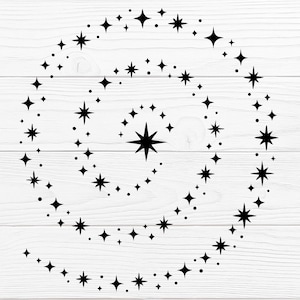 May include: Black star spiral design on a white wooden background. The design features a spiral of various-sized stars and dots, creating a celestial or cosmic theme. The stars are solid black and arranged in a swirling pattern.
