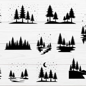 Op de afbeelding: Een verzameling zwarte silhouetontwerpen met verschillende buitenscènes. De ontwerpen omvatten bergen, dennenbomen, rivieren en een hut. Sommige ontwerpen hebben sneeuwvlokken en een halve maan.