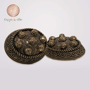 Pair of Viking brooches, Haithabu, bronze or silver-colored