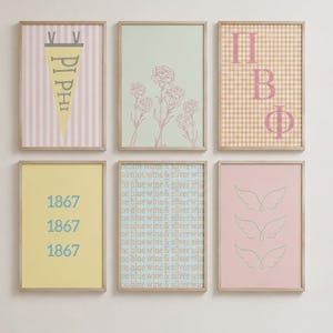 May include: A set of six framed wall art prints. The top left features a yellow pennant with 'PI PHI' on pink stripes. Top middle shows line-art flowers on light green. Top right has 'ΠΒΦ' on a tan gingham background. Bottom left displays '1867' in blue on yellow. Bottom middle lists 'wine & silver' repeatedly. Bottom right shows three sets of line-art wings on pink.