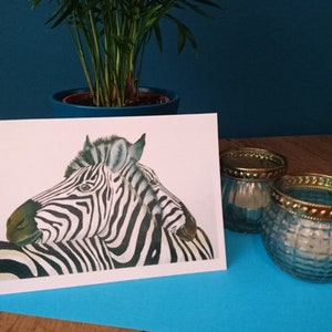 Un biglietto di auguri con due zebre coccole
