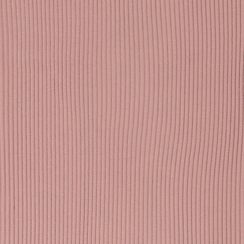 May include: A close-up of a ribbed fabric in a dusty rose color. The fabric has a vertical texture.