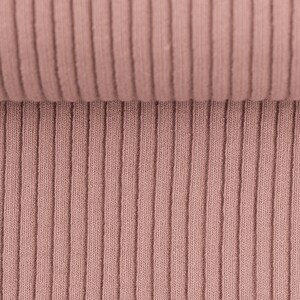 May include: Close-up of a ribbed fabric in a dusty rose color. The fabric is soft and has a subtle texture.