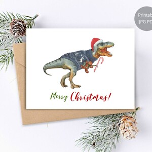 Cartão de natal dinossauro, impressões em aquarela de tiranossauro, cartão de férias, cartão imprimível de dinossauro, feliz natal, cartão pintado à mão