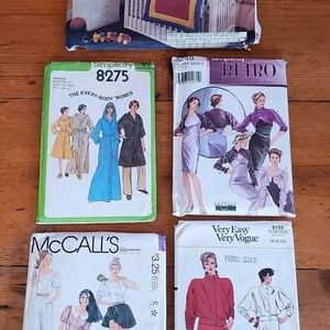 May include: Five different sewing patterns for clothing and home decor. The patterns are for a baby crib set, robes, dresses, and tops. The patterns are from Simplicity and McCall's.
