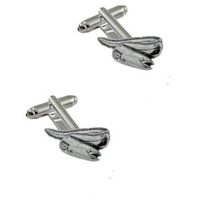 May include: Silver-toned cufflinks featuring a detailed eel design. The cufflinks have a rectangular post and a curved, fish-like body. The eel's head is visible, with an open mouth. The background is plain white.