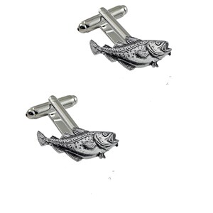 May include: A pair of silver cufflinks featuring a detailed, three-dimensional design of a cod fish.