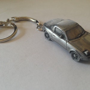 japan  sports classic car MX5 with hard top and raised head lamps ref124 car keyring  or pin badge classic car