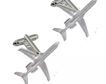 May include: A pair of silver airplane cufflinks. The cufflinks are detailed and realistic, with the airplanes in a flying position.