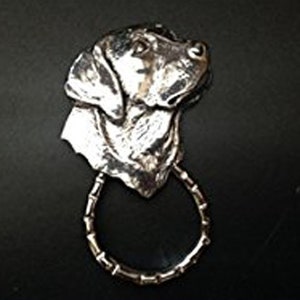 May include: Silver Labrador Retriever dog head sculpture with a bamboo ring attached to the bottom. The sculpture is detailed and realistic.