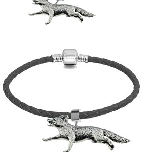 May include: A black leather bracelet with a silver charm of a running fox. The bracelet has a silver clasp and a silver ring to attach the charm.