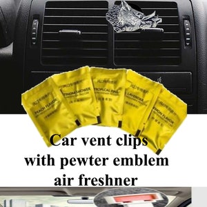 May include: Car vent clips with a pewter boar emblem and a set of six yellow air freshener sachets. The sachets have different scents: Peach Flavor, Tropical Fine, Lemon Flavor, Lavender, and Storm Shower.