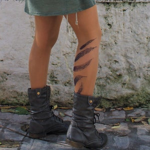 Tattoo Tights: Express your style with our unique tights in vibrant tattoo designs, this one exclusive features feather print.