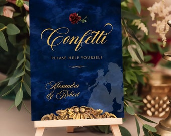May include: A blue and gold confetti sign with a silhouette of Belle and the Beast from Beauty and the Beast. The sign reads "Confetti Please Help Yourself Alexandra & Robert".