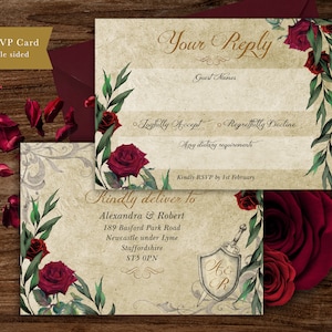 May include: A vintage-style RSVP card with a floral design featuring red roses and green leaves. The card has a gold inscription that reads "Your Reply" and includes space for guest names, RSVP options, dietary requirements, and a delivery address. The card also features a shield with the initials "A & R" and a sword.