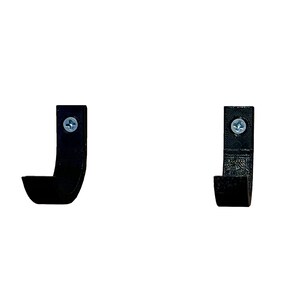May include: Two black plastic hooks with a screw in the top. The hooks are mounted on a white wall.