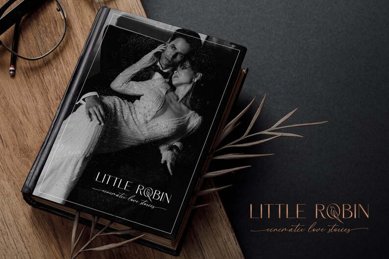 May include: A black and white photo of a couple on a book cover. The book cover is black with white text that reads "LITTLE ROBIN - cinematic love stories".