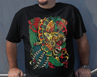 May include: A black t-shirt with a colorful graphic print of a jaguar wearing a headdress. The headdress is adorned with feathers, beads, and geometric patterns. The jaguar's eyes are red, and its mouth is open in a roar.