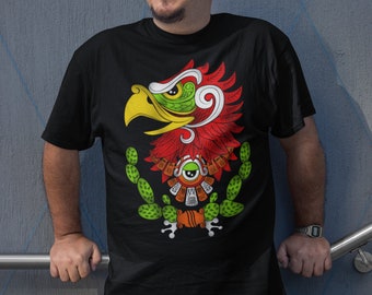 Puede incluir: Una camiseta negra con un gráfico colorido de un águila con un diseño verde y rojo. El águila está posada en un cactus con un pico amarillo y ojos verdes.