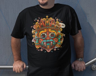 Puede incluir: Una camiseta negra con un estampado gráfico colorido de una máscara estilizada con flores y patrones geométricos.