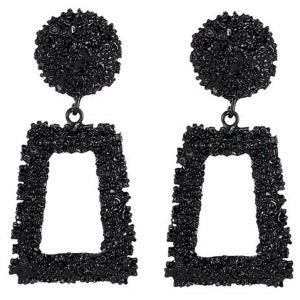 May include: A pair of black geometric earrings with a textured finish. The earrings are shaped like a rectangle with a smaller rectangle cut out in the center.