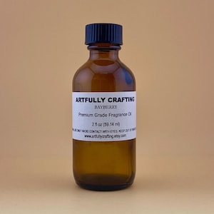 May include: A brown glass bottle with a black cap, labeled "ARTFULLY CRAFTING BAYBERRY Premium Grade Fragrance Oil 2 fl oz (59.14 ml)".