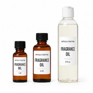 Artfully Crafting fragrance oil packaging in 1 oz and 2 oz amber glass bottles and an 8 oz clear plastic bottle