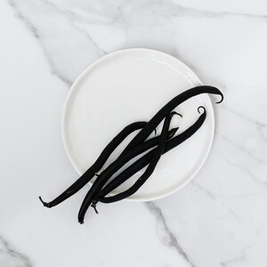 Dried vanilla pods representing scent in premium grade, phthalate-free Exotic Oud Wood Fragrance Oil in soap and candle making