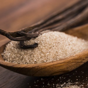 Closeup of dried vanilla and raw sugar representing scent in phthalate free, premium grade Exotic Oud Wood Fragrance Oil for soap and candle making