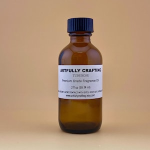 May include: A 2-ounce amber glass bottle with a black cap, labeled "Artfully Crafting" and "TUBEROSE Premium Grade Fragrance Oil".
