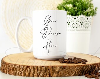 May include: White ceramic mug with a black inscription that reads "Your Design Here" on a wooden slice with coffee beans scattered around it.