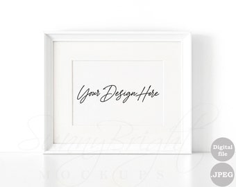 May include: White picture frame mockup with a white mat and the text "Your Design Here" in black script font.