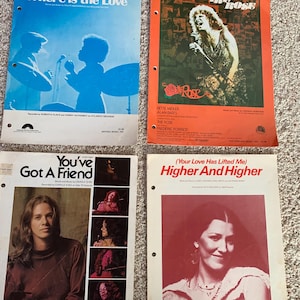May include: Four vintage sheet music covers. Titles include "Where is the Love," "The Rose," "You've Got a Friend," and "Higher and Higher." Each cover features a different design, with images of musicians and song titles in various fonts and colors.